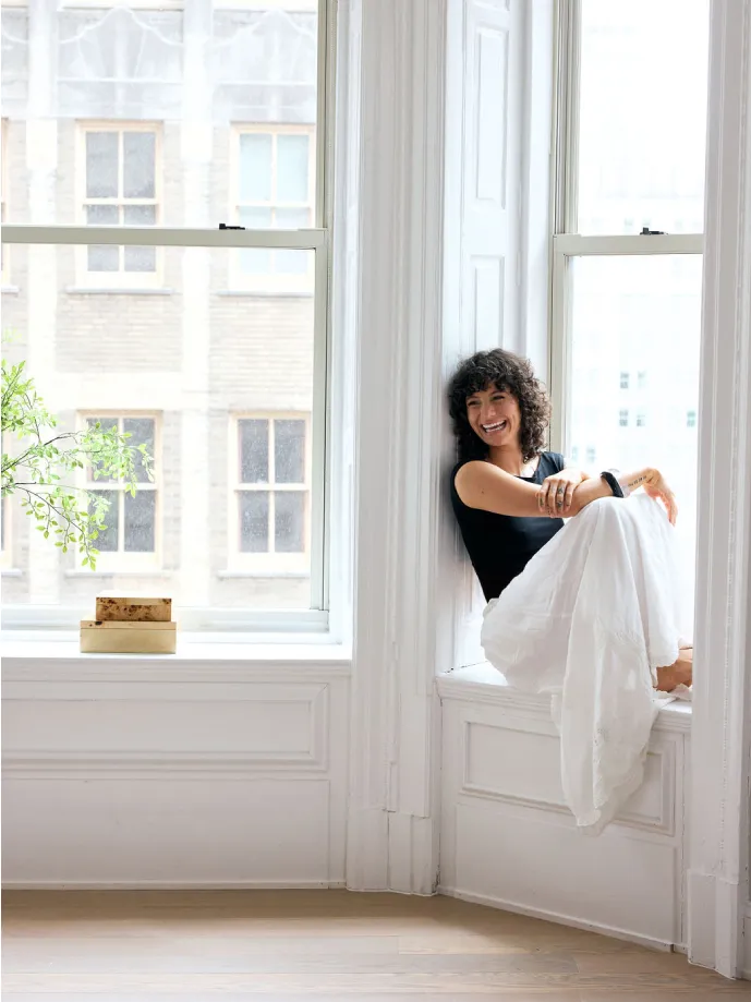 Woman sitting in the window